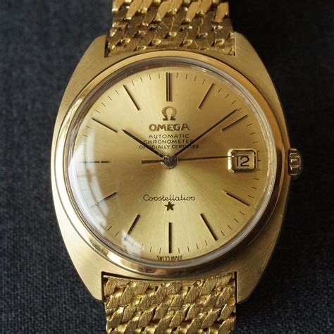 omega constellation yellow gold.